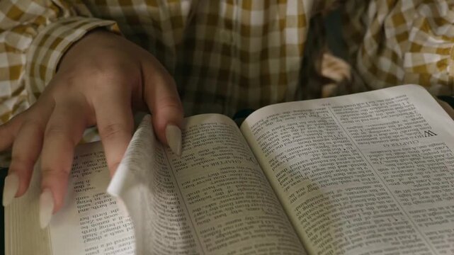 conservative Woman Reading the Bible at table with bread food and drink indoors