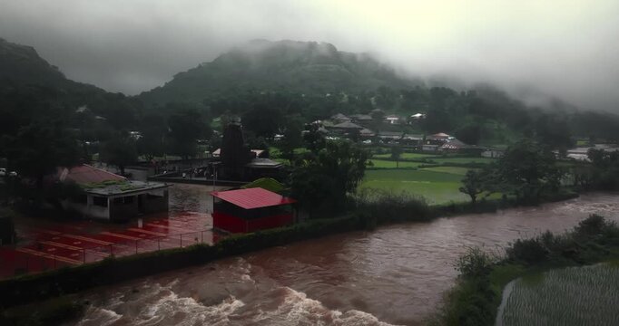 Bhandardara, Maharashtra, during the peak monsoon season. The lush green landscape, mist-covered hills, and powerful cascade reflect the natural grandeur of the Western Ghats.