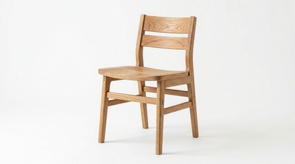 Obraz premium A single wooden chair sits alone in a plain white room interior.