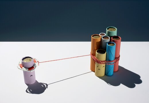 Colored rolls with lifesaver representing a financial crisis