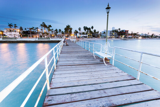Mexico, Baja California Sur, La Paz, wooden boardwalk at blue hour