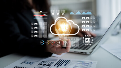 A professional holds a lightbulb symbolizing innovation amidst cloud computing and AI graphics,...