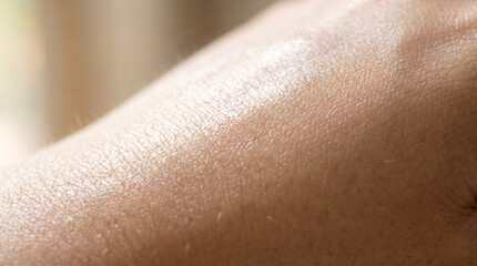 Fototapeta premium Macro photography of human skin texture with natural sunlight reflection for moisture hydration and organic skincare beauty product ad banner.