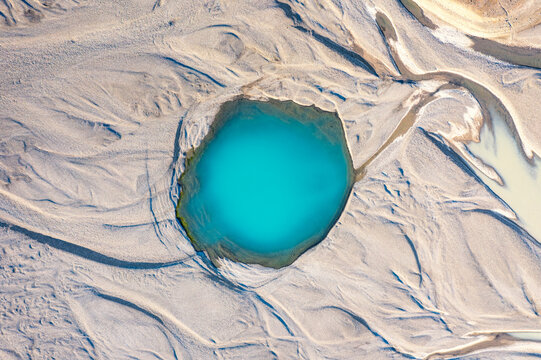 Aerial view of a turquoise pool in Skeidararsandur plain Iceland