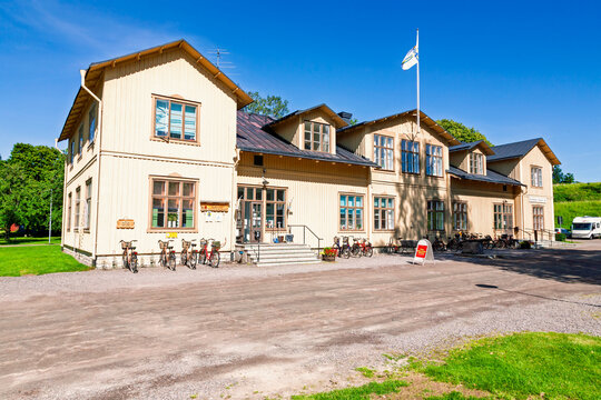 Youth hostel in a wooden building with bicycles parked outside in karlsborg, Sweden
