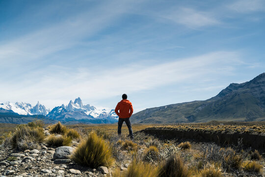 Hiker observing Fitz Roy mountain peak in Patagonia wilderness