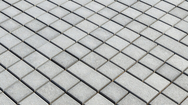 Gray paving stones texture background in perspective
