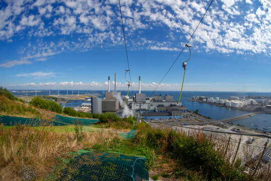 CopenHill innovative waste-to-energy power plant in Copenhagen that features a functioning artificial ski slope, hiking trails, and the world's tallest climbing wall on its roof