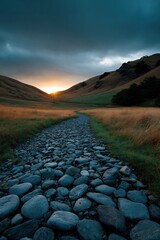 Fototapeta premium Stone path stretching toward glowing sun in narrow valley