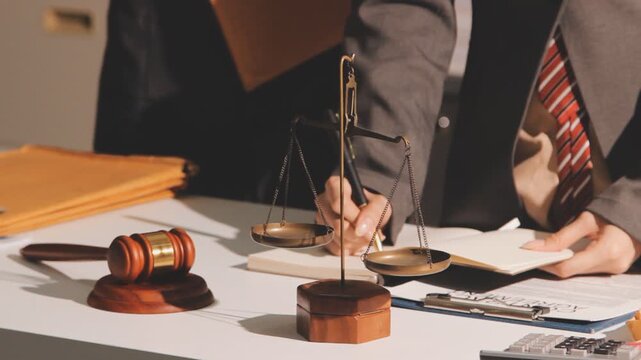Lawyer explained to the client about the law that must be brought against the court case.