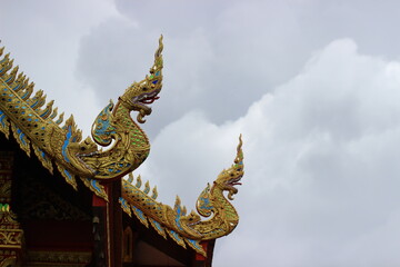 Obraz premium The temple roof features beautiful Naga (serpent) motifs.