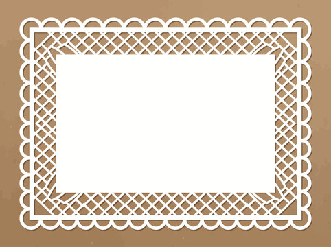 A decorative cutwork rectangular border design features a flat pattern on a brown background.