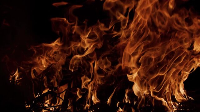 Fire blazing with powerful motion. Fire burning realistic flames. Fire glowing fiery pattern. Fire overlay for video projects.
