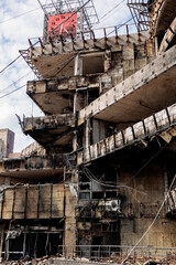 Fototapeta premium A burned-out shopping mall building after being hit by a missile. The aftermath of Russia's missile attack on the Ukrainian capital, Kyiv. The clock stopped at the time of the missile impact.
