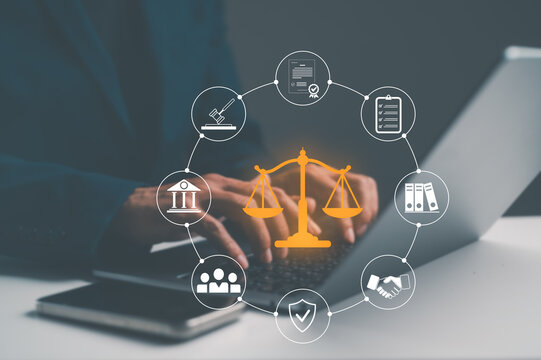 A person using a laptop with legal icons surrounding a central golden scale, symbolizing law, justice, and legal services.