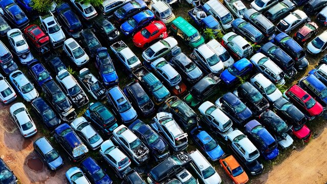 Dense Car Scrapyard Packed with Scrapped and Damaged Vehicles
