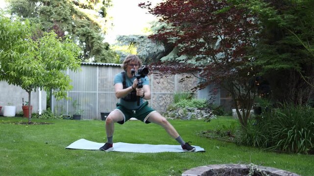 Videographer shifts body weight from one leg to the other while operating a camera stabilizer Improving balance coordination and smooth motion for dynamic filming
