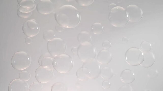 Transparent floating bubbles abstract background, soft minimal motion loop 4k