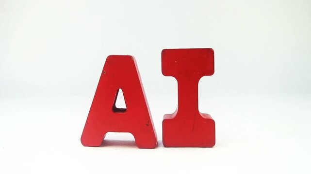 The word AI with red wooden letters isolated on white 