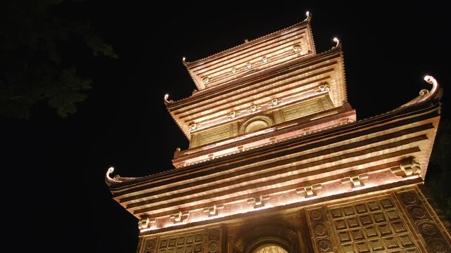 Illuminated buddhist pagoda in vietnam, revealing traditional asian architecture and spiritual landmark, Hoa Lu, Vietnam