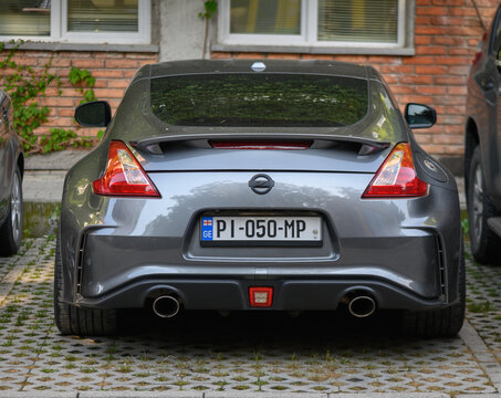 June 11, 2026, Tbilisi, Georgia Gray Nissan 370Z Sport Coupe Rear View with Spoiler and Dual Exhaust