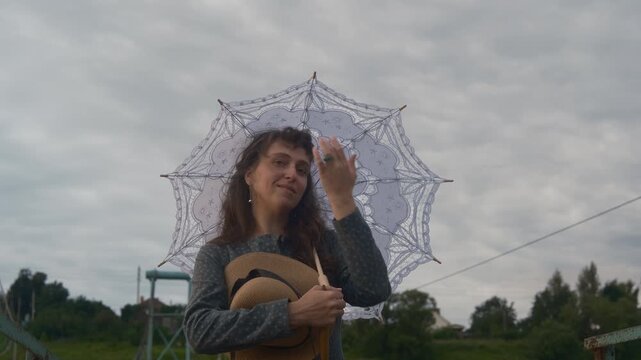 Cinematic Period Piece - Elegant Woman in Historical Dress with Lace Parasol on Rural Bridge. scene showcasing a woman in meticulously authentic late 19th or early 20th-century attire