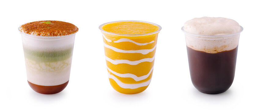 Delicious refreshing summer beverages in plastic cups. Fresh iced matcha latte, mango smoothie and coffee.