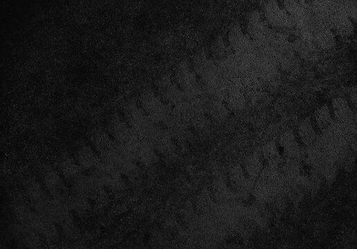 Close up black tire marks on cement floor.
