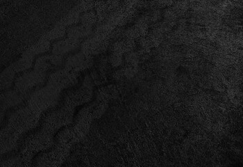 Close up black tire marks on cement floor. © Nattawut