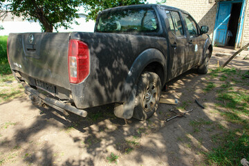 Pickup Truck Undergoing Maintenance in Rural Setting © Igor