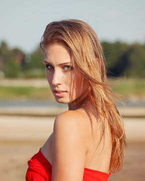 Blonde woman wearing red top