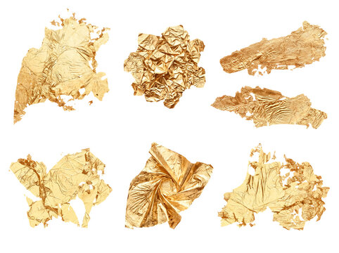 Collection of unique crumpled and torn golden foil pieces, isolated on a transparent background for design projects.