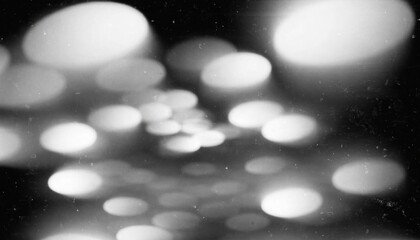 Oval light bokeh patterns during a dark night creating a dreamy abstract background for design © Alamgir@