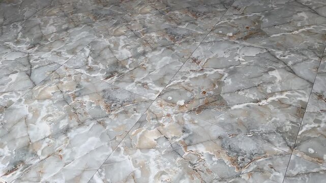 Glossy ceramic floor tiles with abstract pattern texture