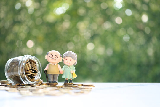 An elderly couple figurine standing with an overturned jar of coins, symbolizing retirement savings, financial security, pension planning and wealth management for seniors.