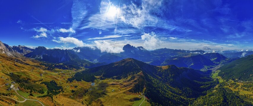 The Picberg, in the background the peaks of the Sassolungo Group, shrouded in mist, wide-angle panoramic shot, drone shot, Val Gardena, Dolomites, Autonomous Province of Bolzano, South Tyrol, Italy
