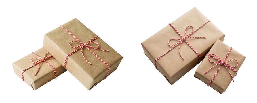 Two gift boxes wrapped in brown craft paper with red and white twine isolated on transparent background
