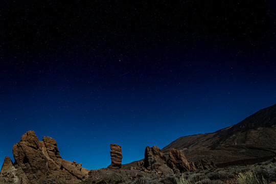 Starry night sky over the Roques de Garcia in Teide National Park, Tenerife