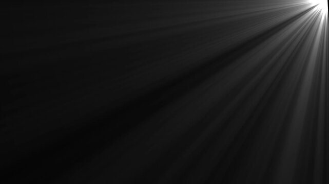 Light rays volumetric beam loop overlay effect from top right corner flashing sunburst optical lens flare shining abstract motion graphic background isolated on black backdrop.