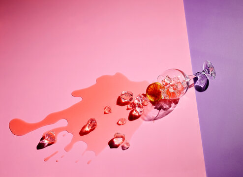High angle view of drink fallen on colored background