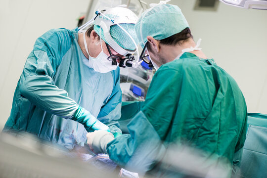 Heart surgeons during a heart valve operation