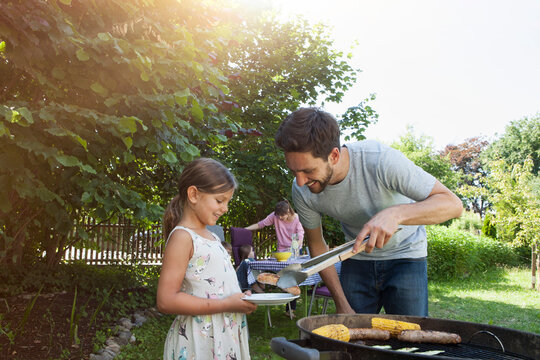 Family having a barbecue in garden