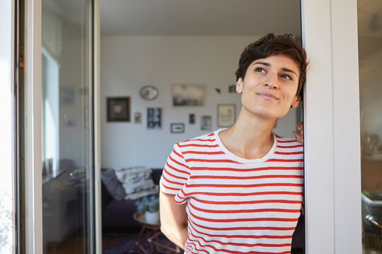 Portrait of woman at home thinking