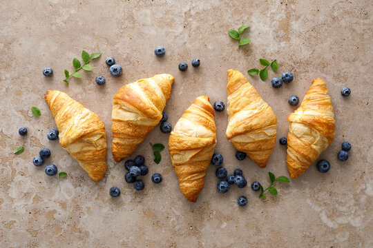 Croissant with blueberries for breakfast