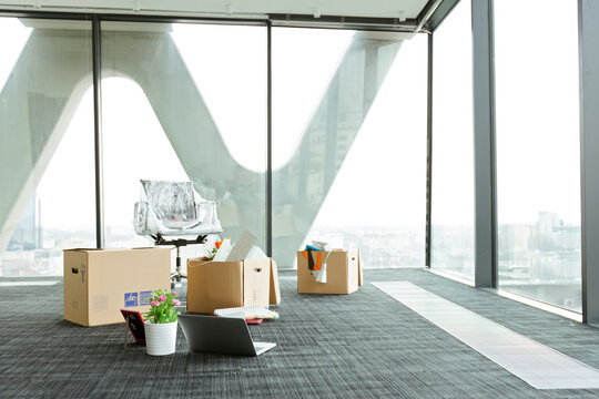 Cardboard boxes on empty office floor