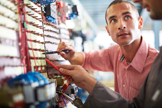 Two electricians at work