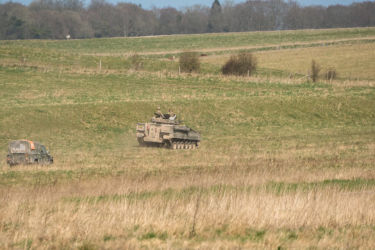 British army FV510 IFVs in action on a military exercise 
