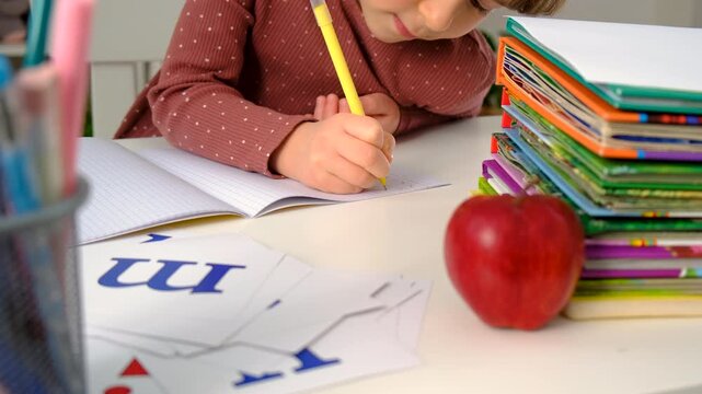 A child doing homework at home. Selective focus.