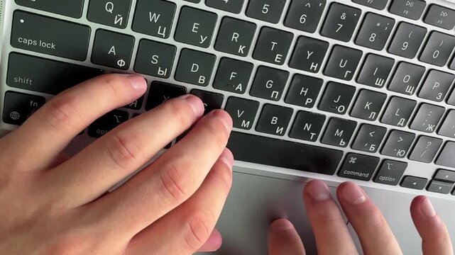 Close-up video of a laptop keyboard used for work, communication and digital tasks. Technology and productivity concept representing modern office, remote work and everyday computing.