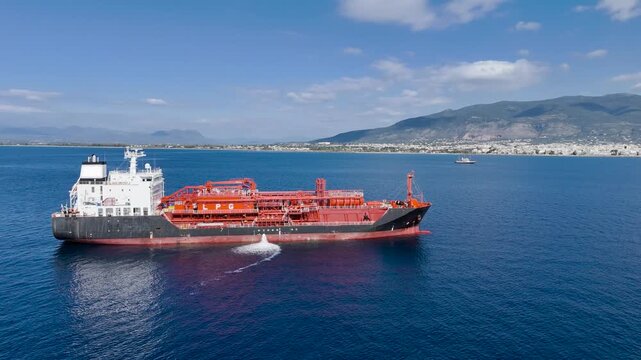 Aerial View of LPG Gas Carrier Tanker Anchored Offshore Near Kalamata in Messinian Gulf, Peloponnese Greece on Calm Blue Sea with Coastal Mountains and Clear Sky